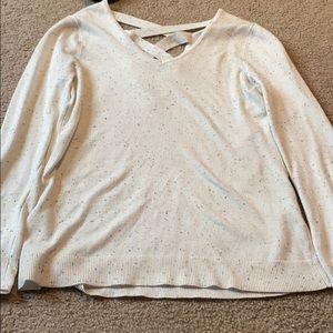 V neck cream colored sweater with cross detailing!